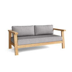 Anderson Teak Palermo deep seating loveseat in a designer color, showcasing comfortable outdoor lounge furniture with plush cushions.
