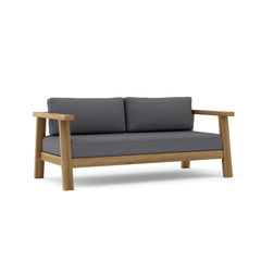 Palermo deep seating loveseat by Anderson Teak in one of nine designer colors, showcasing comfortable outdoor furniture design.