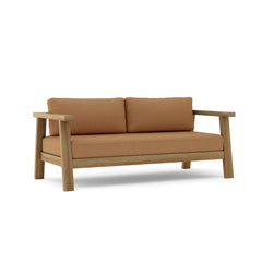 Anderson Teak Palermo deep outdoor loveseat in cast pomegranate, featuring solid A-grade teak wood for small elegant patio spaces.
