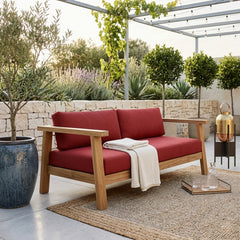 Anderson Teak Palermo deep seating loveseat in cast pomegranate, outdoor teak wood, perfect for small elegant patio spaces.