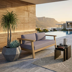 Anderson Teak Palermo deep outdoor loveseat in cast pomegranate color, small elegant teak patio seating with a solid wood design.