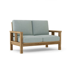 Southbay deep seating teak wood loveseat by Anderson Teak, shown in cast pomegranate with a plush cushion for outdoor patio seating.
