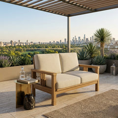 Southbay deep seating teak wood loveseat by Anderson Teak, shown in cast pomegranate, with plush cushions and stylish design.