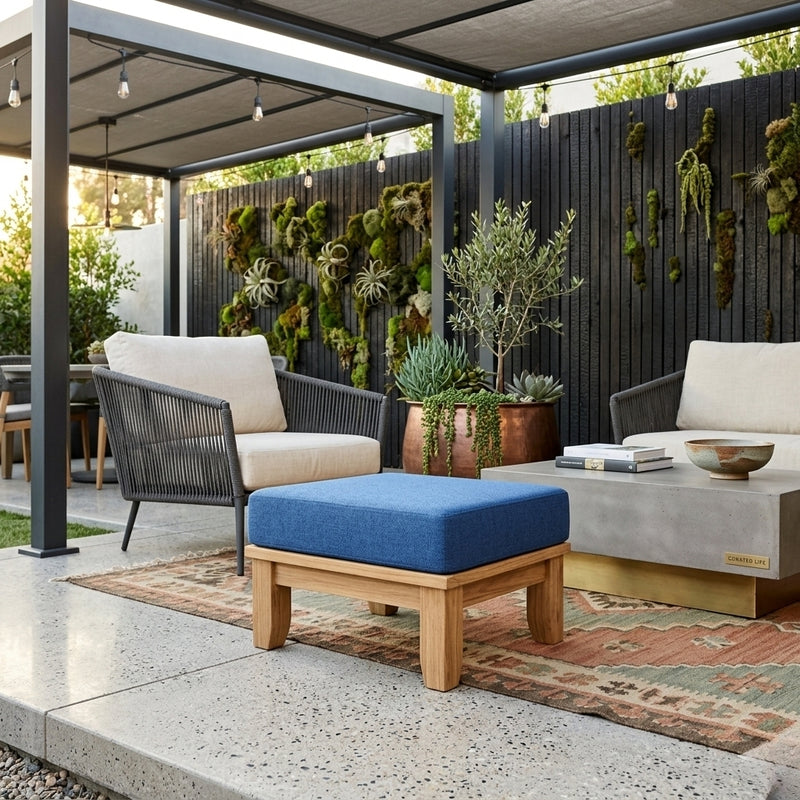 Luxe Anderson Teak ottoman with cushion in nine designer colors, showcasing a modern footstool with plush upholstery.