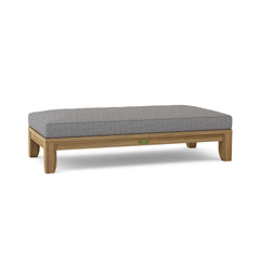 Anderson Teak Riviera 60-inch outdoor daybed in cast pomegranate with a teak frame, featuring 9 designer color options for garden lounging.
