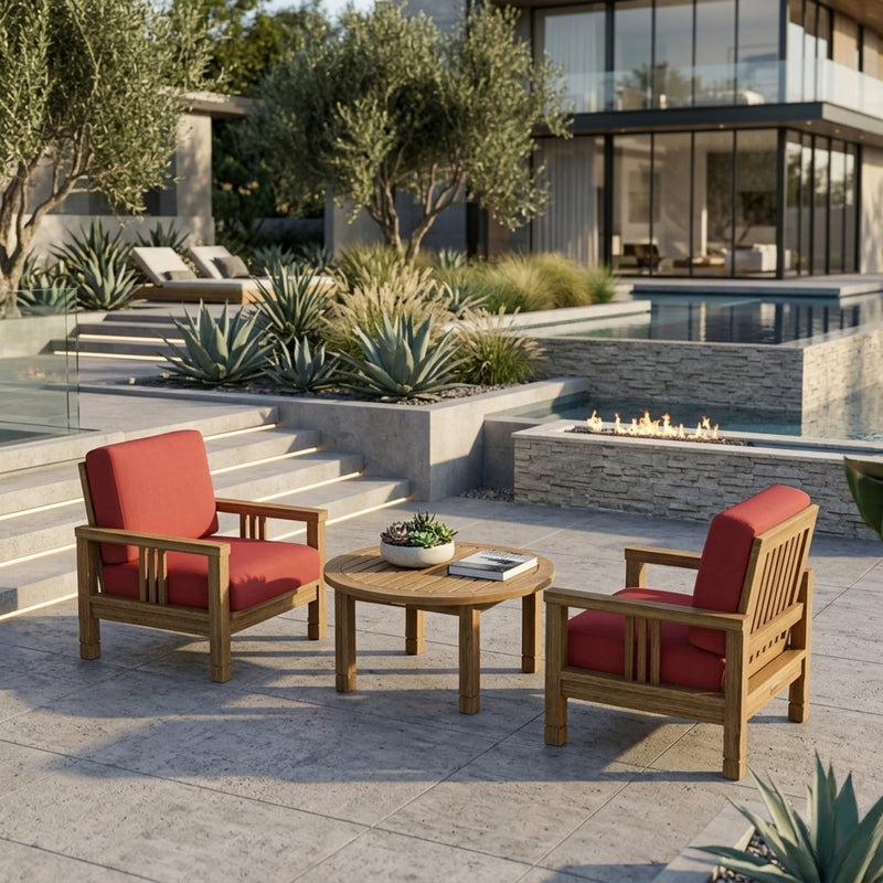 Anderson Teak Southbay outdoor teak wood deep seating 3-piece set with 2 armchairs and table in a garden lounge setting.