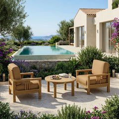 Anderson Teak Southbay teak wood outdoor sofa set with two armchairs and table in a garden lounge setting.