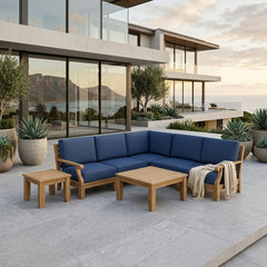 Anderson Teak Riviera Teak Wood Outdoor Sofa set with deep seating and cushions, in a garden lounge setting with multiple color options.