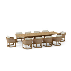 Anderson Teak 11-piece Catania outdoor dining table set with plush sofa and designer-colored cushions on patio.