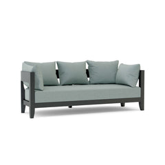 Outdoor aluminum sofa from Anderson Teak with 9 designer colors, featuring sleek modern design and comfortable seating.