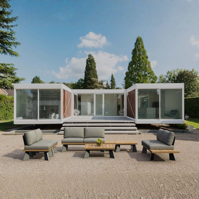Outdoor sofa from Anderson Teak Oxford Deep Seating Set in 9 designer colors, featuring plush cushions and modern teak frame.