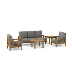 Southbay Teak Outdoor Sofa Set by Anderson Teak, deep seating 5-piece patio lounge with colorful cushions on garden deck.