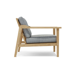 Anderson Teak Amalfi outdoor teak deep seating set with two armchairs and table in vibrant pomegranate color, suitable for garden lounge.