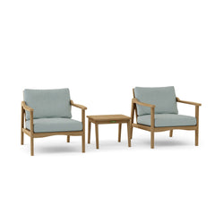 Anderson Teak Amalfi outdoor deep seating set with two armchairs and a table in pomegranate color, ideal for garden lounge decor.