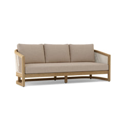 Anderson Teak Catania outdoor 3-seater sofa with natural teak wood frame, canvas cushions, perfect for garden lounge, available in 9 colors.