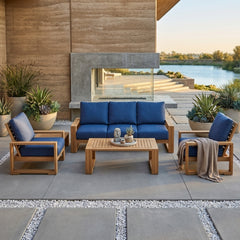 Anderson Teak Capistrano teak wood outdoor sofa set with natural canvas cushions, perfect for garden lounge and patio seating.