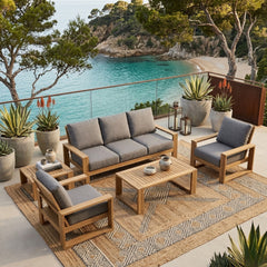Anderson Teak Capistrano teak wood outdoor sofa set with beige cushions, designed for garden lounge, in natural setting.