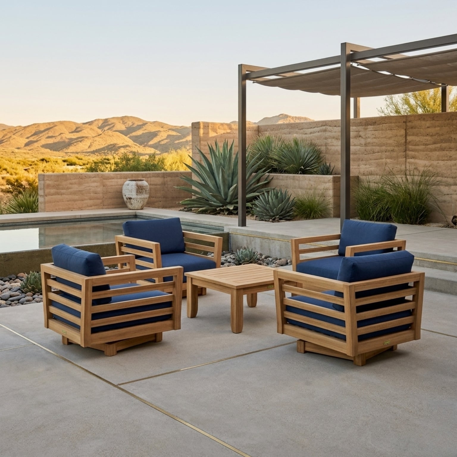 Set of two Anderson Teak Cordoba Teak Wood outdoor patio swivel lounge chairs with colorful cushions for garden seating.