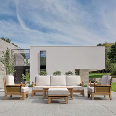 Anderson Teak SET-68 Luxe Teak Wood Outdoor Sofa Set with deep seating and four cushions, in a garden lounge setting.