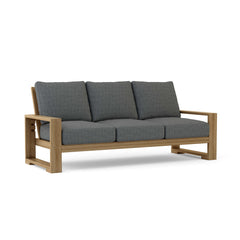 Anderson Teak Capistrano teak wood outdoor patio 3-seater sofa in cast mist color, perfect for garden lounge seating.
