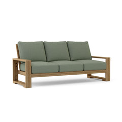 Anderson Teak Capistrano teak wood outdoor 3-seater patio sofa in cast mist color for garden lounge.