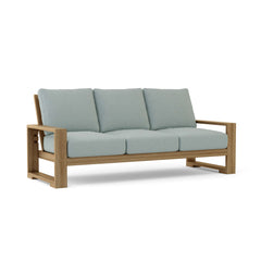Anderson Teak Capistrano 3-seater teak wood outdoor sofa in cast mist color, perfect for garden lounge with stylish design.