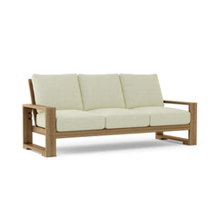 Capistrano deep seating sofa by Anderson Teak in nine designer colors, featuring plush cushions and modern outdoor furniture design.