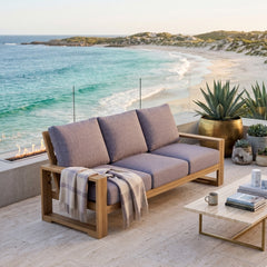 Anderson Teak Capistrano teak wood outdoor 3-seater patio sofa in cast mist color for garden lounge.