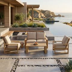 Anderson Teak Capistrano teak wood outdoor sofa set with plush cushions in cast mist color, perfect for garden lounge seating.