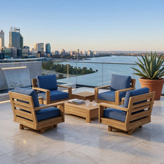 6-piece Anderson Teak outdoor sofa set with deep seating, teak wood construction, in a garden lounge setting with colorful cushions.