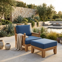 Anderson Teak Luxe Teak Wood deep seating outdoor patio set with one armchair and one ottoman in cast mist color.