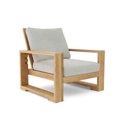 Anderson Teak Capistrano Deep Seating Set with one armchair and table in vibrant cast pomegranate color for outdoor patio use.