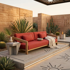 Anderson Teak Smyrna teak wood 4-seater outdoor patio sofa in pomegranate color with garden lounge setting.