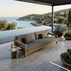 Anderson Teak Smyrna 4-seater outdoor patio sofa in cast pomegranate teak wood, perfect for garden lounge, available in 9 colors.