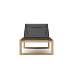 Anderson Teak Junus Sun Lounger with adjustable backrest and teak wood frame in an outdoor setting.