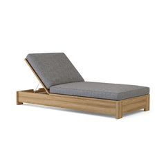 Madera Sun Lounger by Anderson Teak in one of nine designer colors, showcasing a sleek wooden sunbed with a modern design.