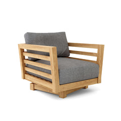 Canvas navy Anderson Teak Cordoba deep seating swivel armchair with a cushioned seat and backrest, outdoor patio furniture.