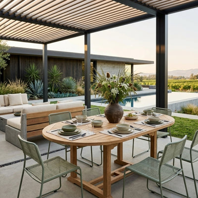 Anderson Teak Bahama 67-inch oval extension table showing a wooden outdoor dining table with extendable leaves.