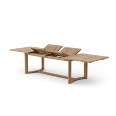 Catania extension table by Anderson Teak showing a spacious wooden table with extendable leaves and a natural teak finish.