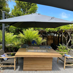Rectangular fireplace table made of teak wood by Anderson Teak, designed for outdoor patio or fireplace area.