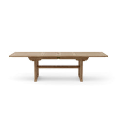 Anderson Teak Sahara 106-inch rectangular double extension dining table with polished teak wood finish and sturdy construction.