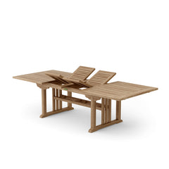 Sahara 106-inch rectangular double extension teak table by Anderson Teak, showcasing polished wood surface and extendable design.