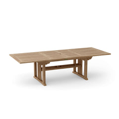 Anderson Teak Sahara 106-inch rectangular double extension table showing polished teak wood surface and sturdy table design.