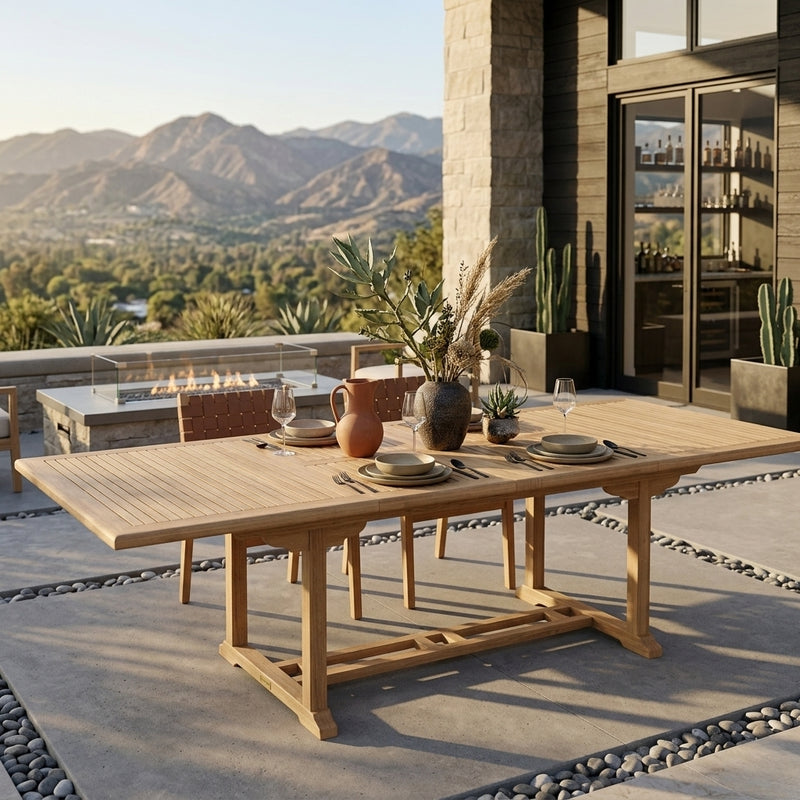 Anderson Teak Valencia 117-inch rectangular luxury outdoor teak double extension dining table for patio, showing polished teak surface.