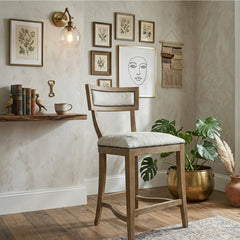 Carvell Cowhide Bar Stool by Zentique featuring a stylish accent chair design with black and white cowhide upholstery and wooden legs.