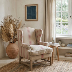 Fabien Zentique wingback accent chair with plush upholstery and elegant wooden legs, stylishly designed for living room decor.
