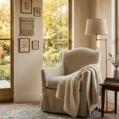 Zentique Fabre armchair featuring elegant upholstery and wooden legs, perfect as a stylish accent chair in living spaces.