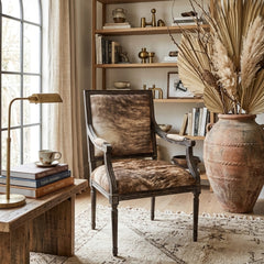 Louis Cowhide Accent Arm Chair by Zentique featuring a stylish cowhide upholstery and wooden legs for a sophisticated look.