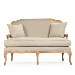 Zentique Bastille Settee with carved oak frame, luxurious indoor loveseat for elegant small living rooms, showcasing detailed woodwork.