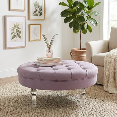 Adalene Ottoman by Zentique featuring a plush fabric cover and wooden legs, serving as a stylish footstool or small accent table.